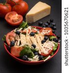 Small photo of Fresh Salad with Chicken, Tomatoes Blueberries and Parmesean Cheese