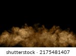 Small photo of Brown-black dust powder explosion. The texture is abstract and splashes float. on a black background