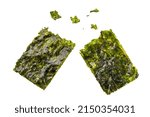 Small photo of Crispy nori sheets tear off with some pieces on white background.
