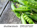 pea pods on wooden table