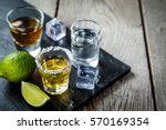 Selection of alcoholic drinks on rustic wood background