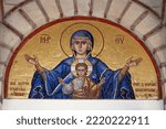 Small photo of Loutraki, Corinthia, Peloponnese, Greece - 18 of August 2022 : Colourful mosaic hagiography of Mother of God ,on the facade above the entrance of the church of Panagia Giatrissa