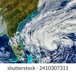 Small photo of Nicole Approaches Florida. The size of the tropical cyclone indicates that the storms effects could be farreaching. Elements of this image furnished by NASA.