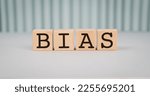Small photo of Wooden blocks with the word Bias. Prejudice. Personal opinions. Preconception