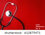 Small photo of world hemophilia day Stethoscope on a red table, concept medicine