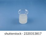 Small photo of Solution of Xanthan Gum in glass flask. Food additive E415. Used in food industry, medicine, cosmetics, beauty products, hair products as binding agent. Natural Thickener gluten-free dood.