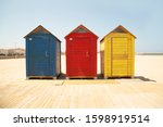Brightly Coloured Beach Huts On ...