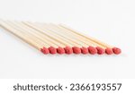 Small photo of Match sticks objects collection. Group of identical matchsticks in a row isolated on a white background. Leadership, individual monotony and crowd concept.