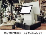 Blank mockup cash desk with white screen in coffee shop