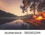 Blured image of camping and tent with high iso grained picture under the pine forest in sunset at Pang-ung, pine forest park , Mae Hong Son, North of Thailand. 
