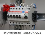 Small photo of RUSSIA,Moscow-October 27, 2021:ABB current circuit breakers and ABB differential current circuit breakers on the din rail in the electrical panel.