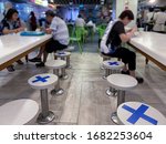 Small photo of Singapore Mar2020 Social distancing rules in practice, alternate seating in local public food courts (restaurants, food outlets), to reduce risk of further transmission; safety measures