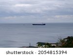 Small photo of The container ship leaves the port. Argosy. Ship at sea.