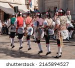 Small photo of Dubrovnik, Croatia - 11 May 2022: Old town square, national croatian dance show, young men in folk costumes dancing, entrance of Church Sveti Vlaho or St. Blaise