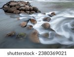 The cobbles in the river were photographed using motion blur technique so that the river water flow looks like satin. 