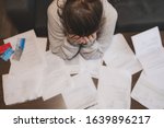 Shocked stressed young woman reading document letter from bank about loan debt financial problem, frustrated worried about bills notification, troubled with bad news or failed test results in mail