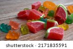 Small photo of Multi-colored marmalade jelly candy's. Dessert marmalade in the form of watermelon slices and rings.