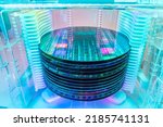Small photo of patterned silicon wafers in a universal pod. Electronic circuit designs have been built onto the wafers using micromaching including photolithography