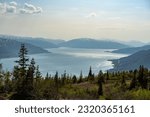 Small photo of Mountain view from Risfjellet, Mo i Rana, Norway. Norwegian mountain landscape in early summer with snow on the high mountain peaks. Pine trees and high altitude. Mountain lake, fjord. Blue and green.