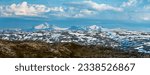 Small photo of View from the peak of Hauknestinden, Mo i Rana, Helgeland, Norway, looking south towards Okstindan, the tallest mountain in Nord-Norge. Snow capped mountains in summer scandinavia. Panorama, hiking