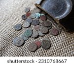 Small photo of Old copper coins of the 17th century of Eastern Europe, Boratinki, 1661-1668. Artifact, archaeological discoveries, search for treasures and artifacts.