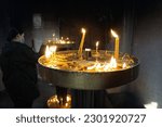 Small photo of Skopje, North Macedonia - February 20, 2021: Candles inside Macedonian Church St. Clement of Ohrid
