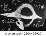 Small photo of Science and black holes.Basic properties of black holes. A scientist writes physical and mathematical formulas on a blackboard with white chalk.Schwarzschild radius