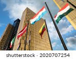 European Flags flapping in the wind, in front of European Union Court of Justice building in Luxembourg Kirchberg. Flags of Luxembourg, Hungary, Lithuania, Austria...