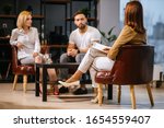 Small photo of woman psychologist consulting young family consisted only of man and woman in modern office, couple can't get along with each other, troubles in relationships, so male and female visit psychologist