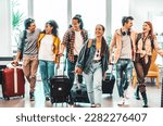 Young group of tourists with suitcases arriving at youth hostel guest house - Happy friends enjoying summer vacation together - Millenial people doing check-in at hotel lobby - Summertime holidays