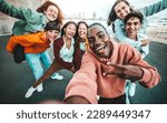Small photo of Multicultural group of friends taking selfie picture with smart mobile phone outside - Millenial people walking on city street - Life style concept with guys and girls hanging out together