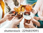 Small photo of Close up image of hands holding cocktail glasses at bar restaurant - Young people having fun hanging out on weekend day - Food and beverage concept with guys and girls drinking alcohol together