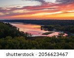 Scenic sunset overlooking the confluence of the Kinnickinnic and St. Croix rivers and delta at Kinnickinnic State Park in Wisconsin during autumn.
