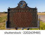 Small photo of Walnut Grove, MN, USA - September 2 2020: Sign indicating location of Almanzo Wilder and Laura Ingalls homestead north of De Smet South Dakota.