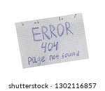 Page not found, server error 404, written on a notebook sheet of paper.