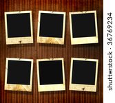 old photoframes are hanging on... | Shutterstock . vector #36769234