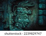 Small photo of Mayan stela, stone relief of the Mayan culture, glyphs and pre-Hispanic forms. Stone textured background.