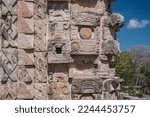 Small photo of Mayan style fretwork, in an archaeological zone, approach to Mayan buildings, view of the details made by the Mayans in pre-Hispanic times, glyphs and representations of deities