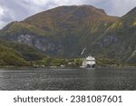 Small photo of flam, norway - 09 28 2023 scenic view of a cruise liner in a fjord in flam