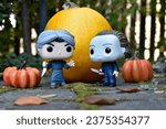 Small photo of Zaporizhzhia, Ukraine - October 15, 2023: Funko Pop action figures of horror characters Norman Bates and Michael Myers. Halloween, spooky season, pumpkins, decor, moss, autumn leaves, garden.