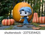 Small photo of Zaporizhzhia, Ukraine - October 15, 2023: Funko Pop action figure of serial killer Norman Bates from classic horror movie Psycho. Halloween, spooky season, pumpkins, moss, autumn leaves, garden.