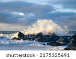 Wave crashing at rocks at danish coast. High quality photo