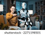 A pretty young girl and her A.I.-equipped Domestic Robot, choose together what to watch on TV