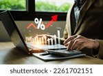 Small photo of interest rates and dividends, Business people calculate and higher graphs and percentages investment returns, stock return income, retirement Compensation fund, investment, dividend tax.