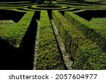 cut hedges into various geometric shapes. Strictly cut evergreen parterres and bosquettes are part of every historic Baroque French garden. some large formations resemble smooth granite boulders