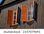 shutters of an old cottage. protects against sun thieves. holiday building with a 19th century made entirely of wood. the windows close with double doors
