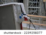 watch out for wet and snowy cables. electrical fuses protect workers on the construction site from injury. interrupts the power supply in time with a current phase protector