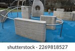 Small photo of serrated, rough surface of concrete walls with twisted railings Parkour and new sport. Its purpose is to learn to move effectively and manage various obstacles. obstacle course jumps, climbing, hole