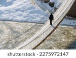 Small photo of Hakkari-Turkey - 02.10.2020: a human on the zap river suspension bridge in winter time