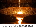Pouring liquid metal from arc furnace
